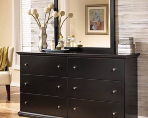 a black bedroom dresser is available as part of furniture rental in High Point.